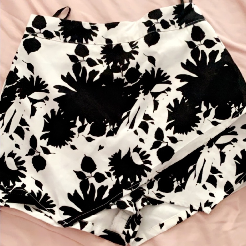 a two piece skirt set with shorts .